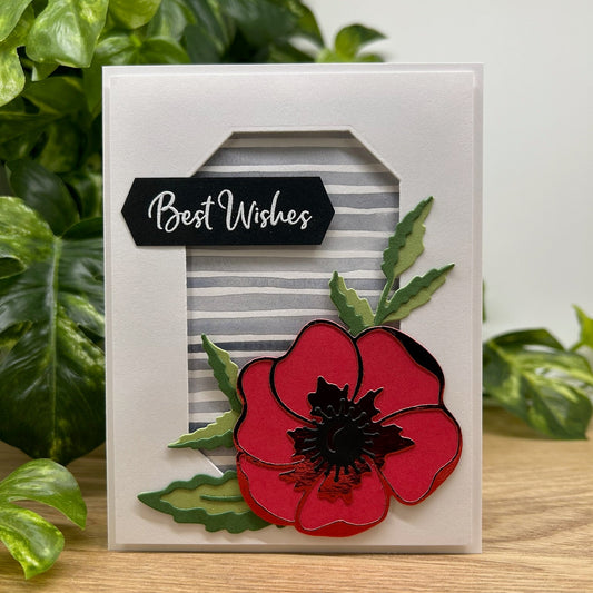Card with a red flower design and 'Best Wishes' text, set against a green leafy background.